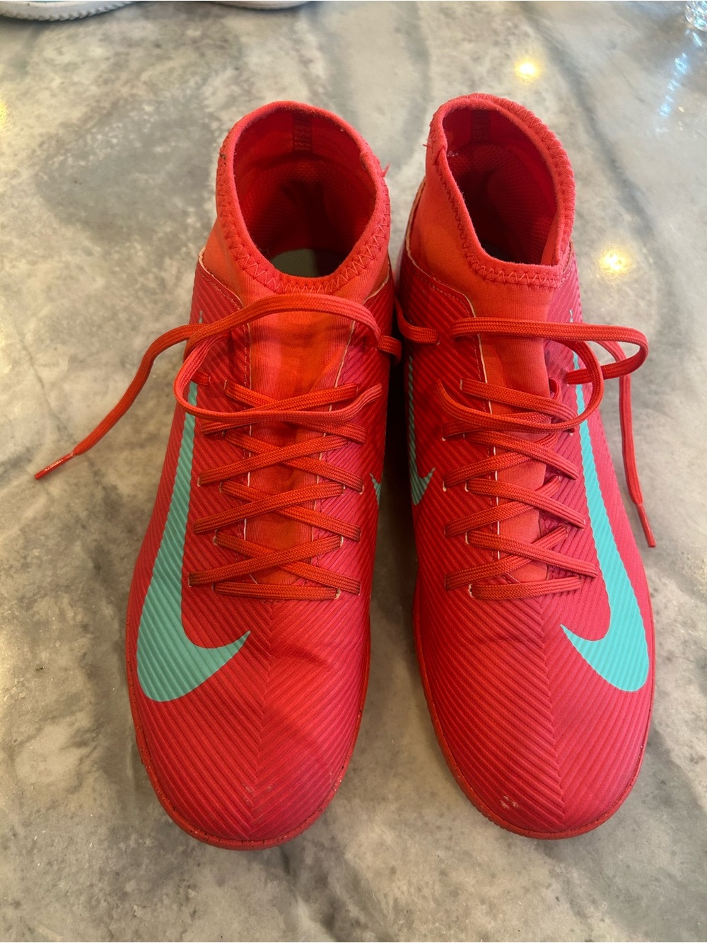 Nike Men’s Red Athletic Soccer Cleats with Teal Swoosh